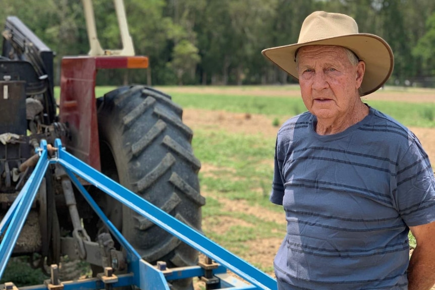 Bill Peterson stands in front of his invention, the Wiking Rollavator.