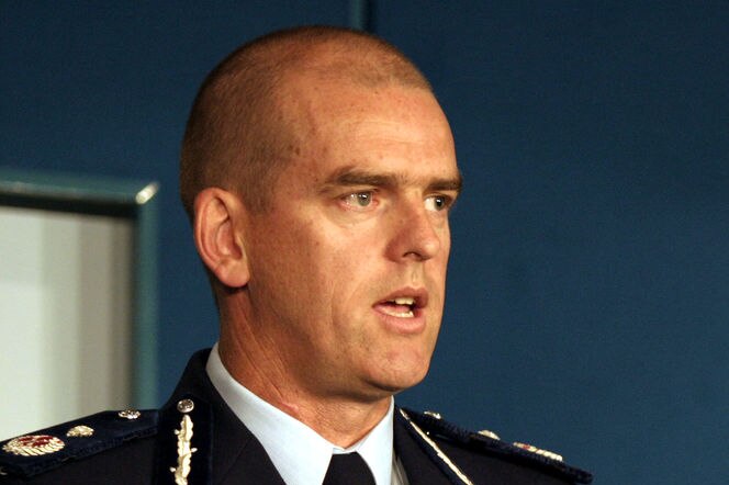 A head and shoulders shot of Simon Overland wearing a police uniform.