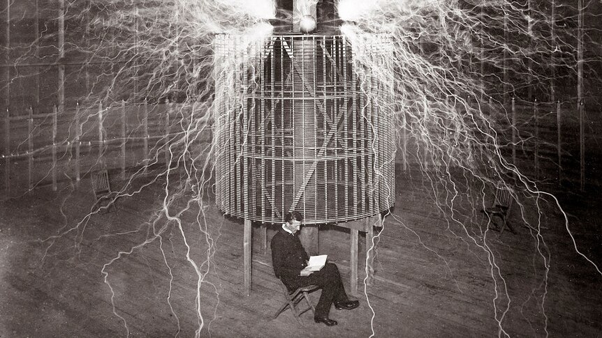 Nicola Tesla sitting in his lab