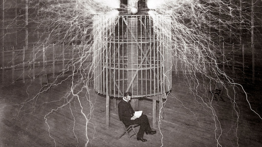 Nicola Tesla sitting in his lab