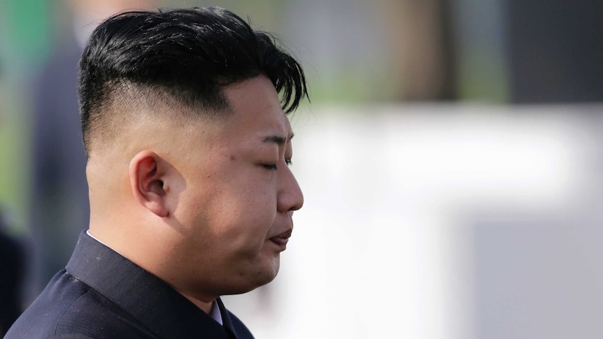 Kim Jong-un reacts as he arrives for the opening ceremony of the Cemetery of Fallen Fighters of the Korean People's Army in Pyongyang.