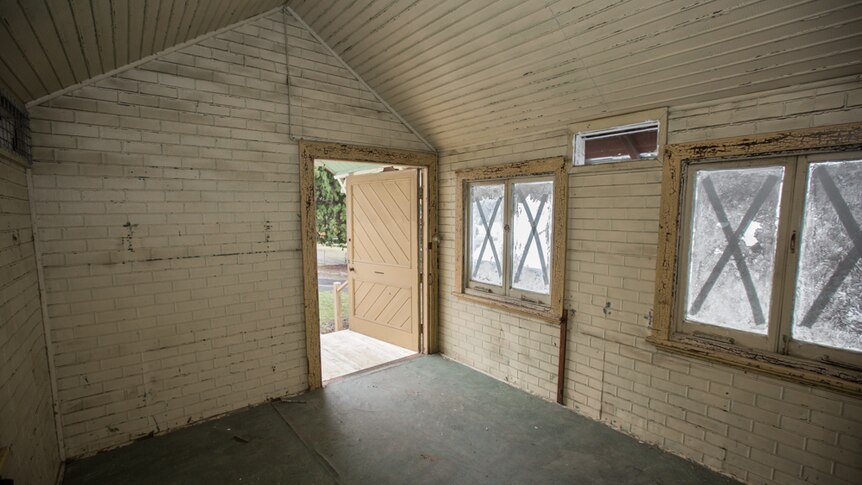 Inside the Alan Rogers Chalet are two rooms, with one containing a wardrobe nearing completion.