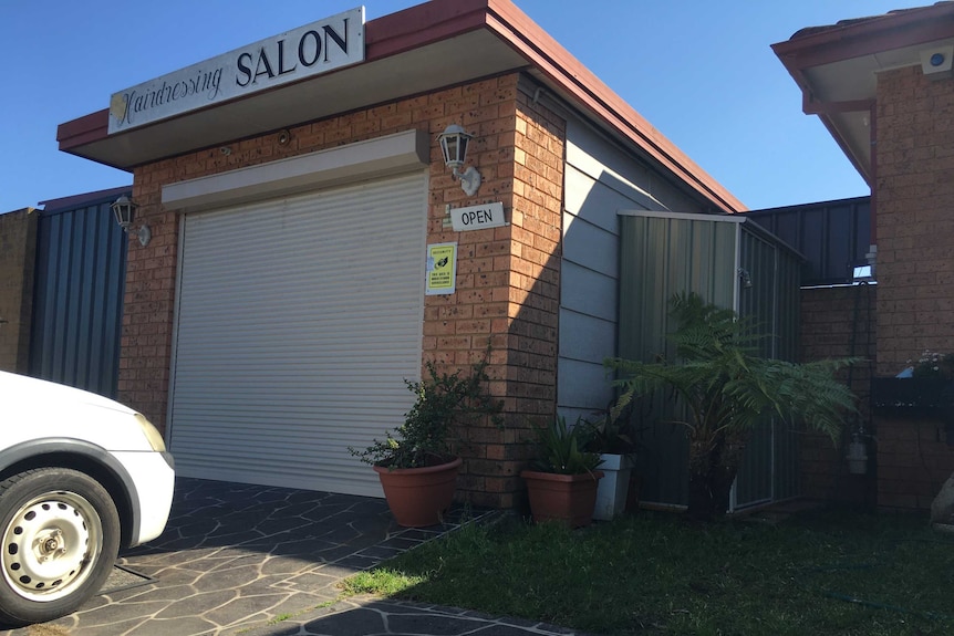A suburban garage converted to a hair salon.