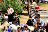 Fleeing Syria: refugees arrive at a makeshift camp near the border with Turkey.