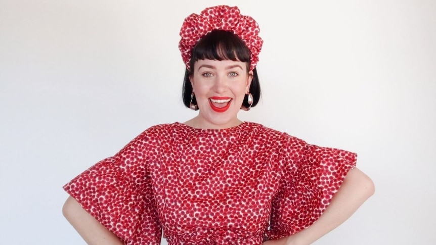 Daisy Braid wearing the scrunchie headband she designed, in a story about turning sewing hobby into work and fame.