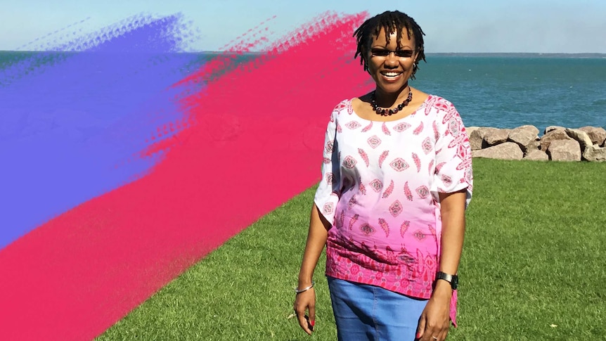 Pauline smiling and standing on a grassy area near the ocean for a story about asking people "Where are you from?"