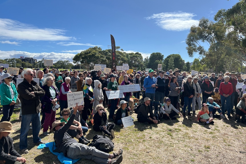 Protesters gather in Adelaide's parklands to oppose a police project.