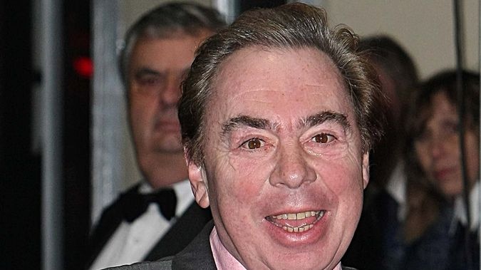 Andrew Lloyd Webber waves upon arriving at the Royal Variety Performance at the London Palladium