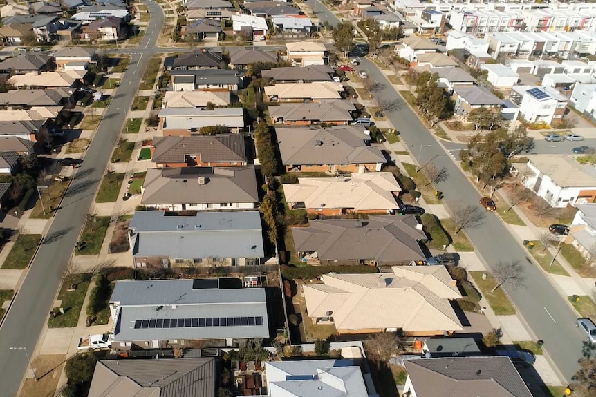 An aerial view of a new suburb with townhouses and apartments.