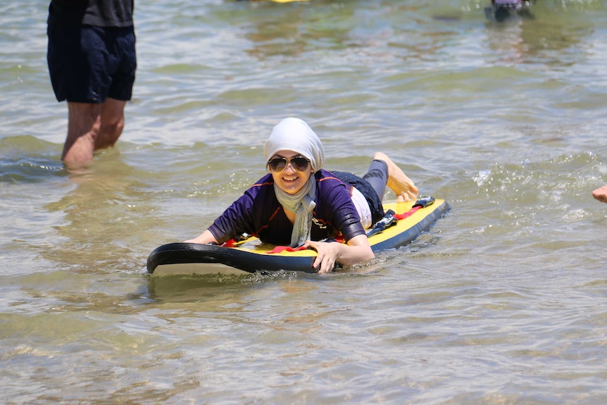 Young woman on surf board