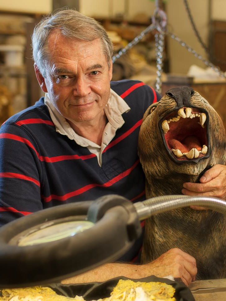 Professor Michael Archer poses with a model of the thylacoleo.
