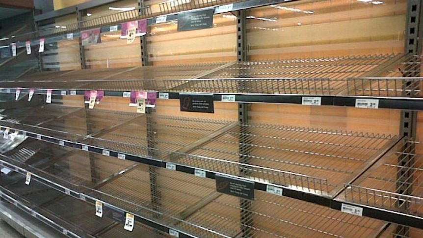 Empty bread shelves at Woolworths in Ashgrove as Brisbane floods on January 11, 2011.