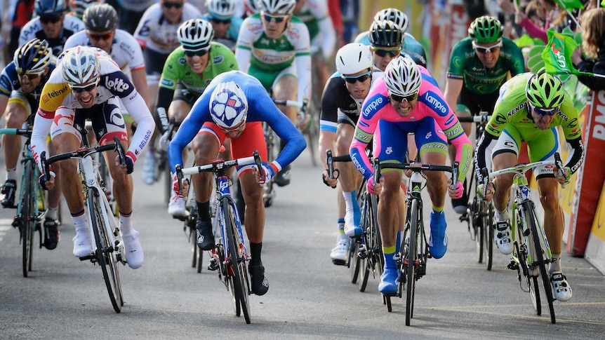Sprint finish ... Nacer Bouhanni (2nd L) wins the first stage of the Paris-Nice cycling race.