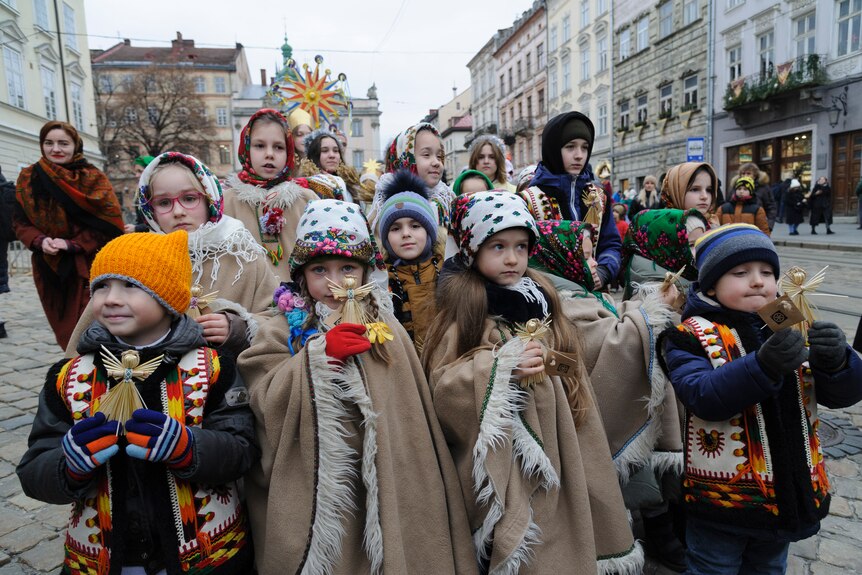 Ukrainian children attend a parade on Orthodox Christmas eve.