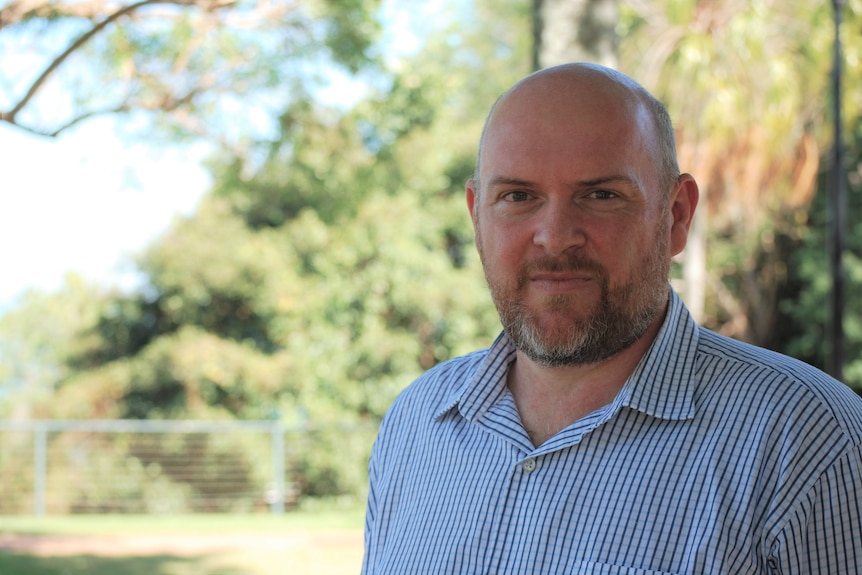 Chris Naylor stands outside in Darwin.