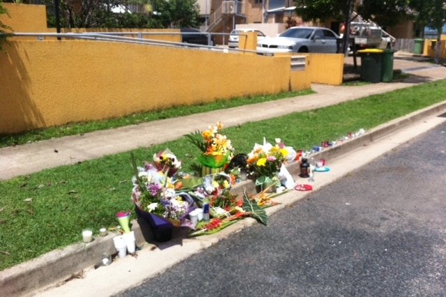 Floral tributes on the street where 23-year-old Shandee Blackburn was murdered in Mackay in north Qld