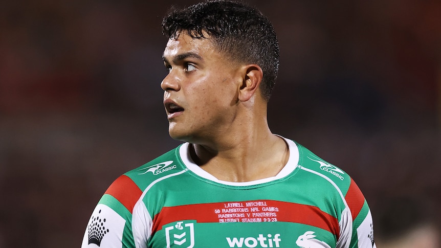Latrell Mitchell looks upwards during a game