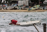 A fisherman checks his boat in Acapulco, Mexico before hurricane Patricia