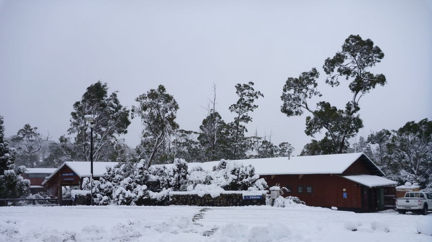 Cradle Mountain building covered in snow.