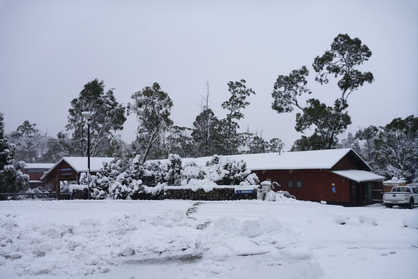 Cradle Mountain building covered in snow.