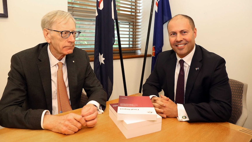 Commissioner Kenneth Hayne (left) and Treasurer Josh Frydenberg as the final report is handed over.