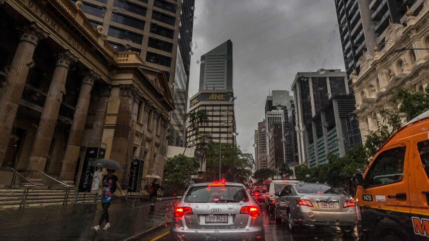 Traffic stands still in the Brisbane CBD as a storm continues overhead