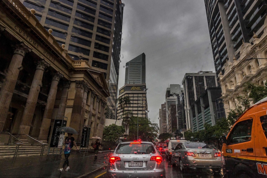Traffic stands still in the Brisbane CBD as a storm continues overhead