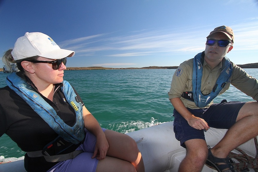 a woman and a man in a boat