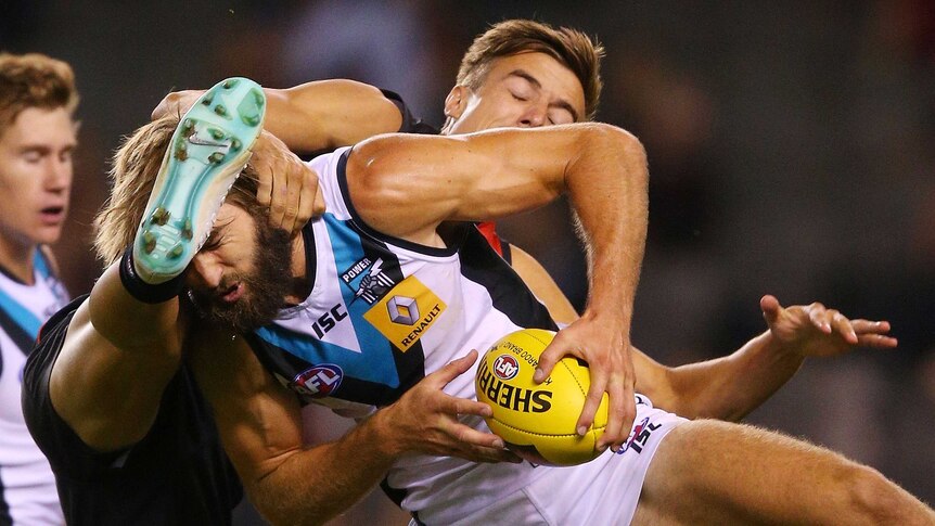 Under the pump ... Justin Westhoff marks the ball ahead of Cale Hooker