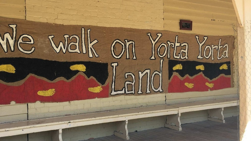 A banner reading 'We walk on Yorta Yorta Land'