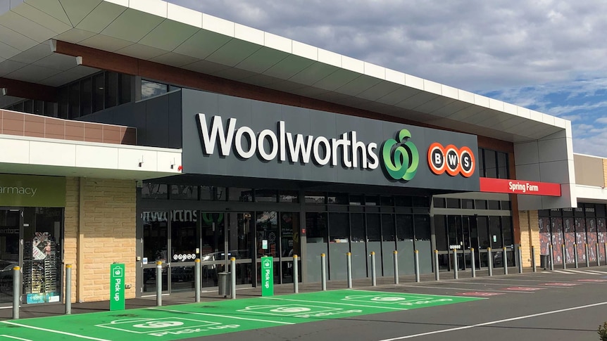 The front of the Woolworths in Spring Farm under a cloudy sky.