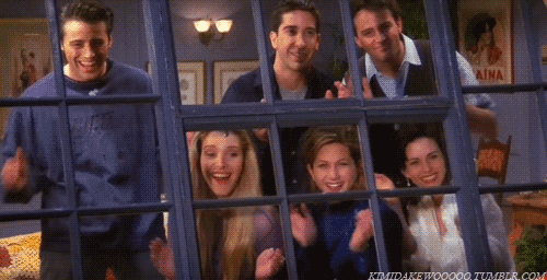 Gif of the cast of Friends sitcom laughing and looking out the window in Monica's apartment.