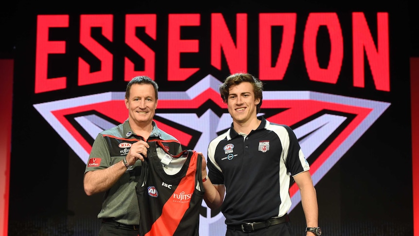 Number one pick Andrew McGrath (R) with Essendon coach John Worsfold at the 2016 AFL draft.
