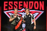 Number one pick Andrew McGrath (R) with Essendon coach John Worsfold at the 2016 AFL draft.