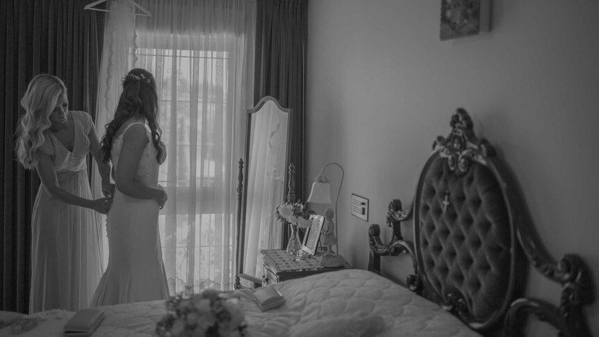 Eleni Kallianiotis gets ready with her maid of honour in her parents' bedroom.