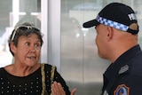 Former Retta Dixon Home resident Sue Roman speaks to NT Police Senior Sergeant Anthony Deutrom.