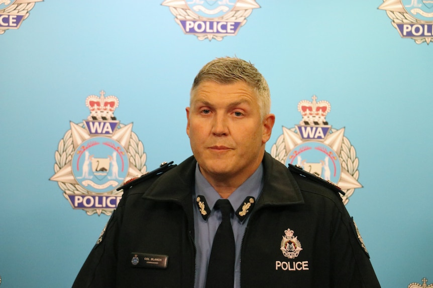 WA Police commissioner Col Blanch wears a uniform and speaks in front of a police background.