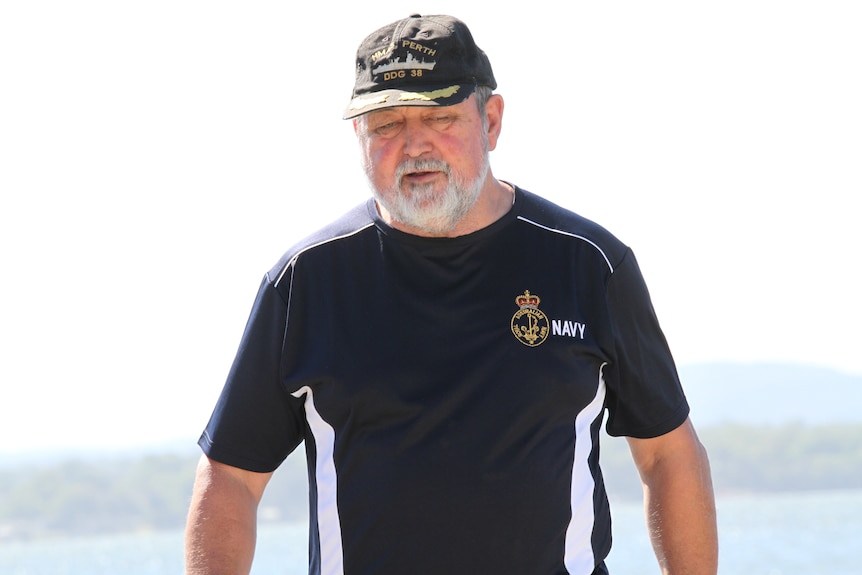 Keith Bailey wears a Navy shirt and cap.