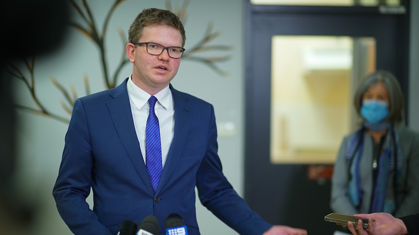 A man wearing a blue suit