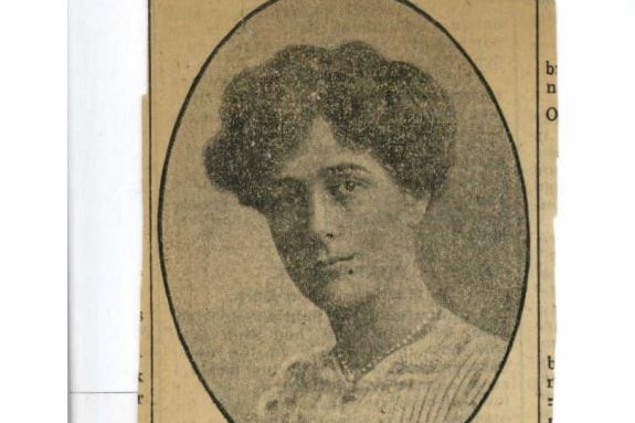 Old newspaper clipping featuring a woman's face and some advertising copy underneath