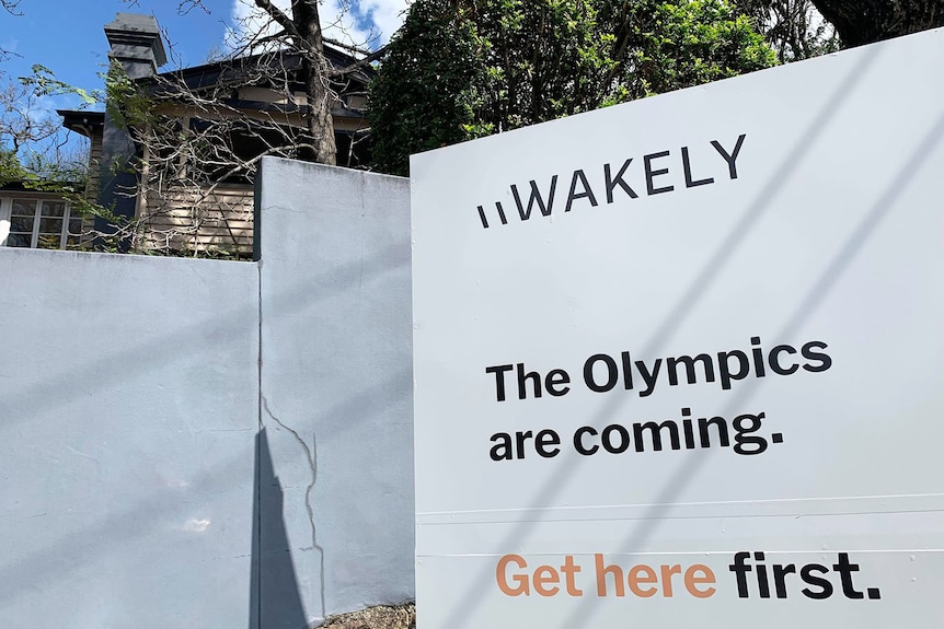 House with For Sale in Brisbane suburb with 'The Olympics are coming. Get here first' on sign