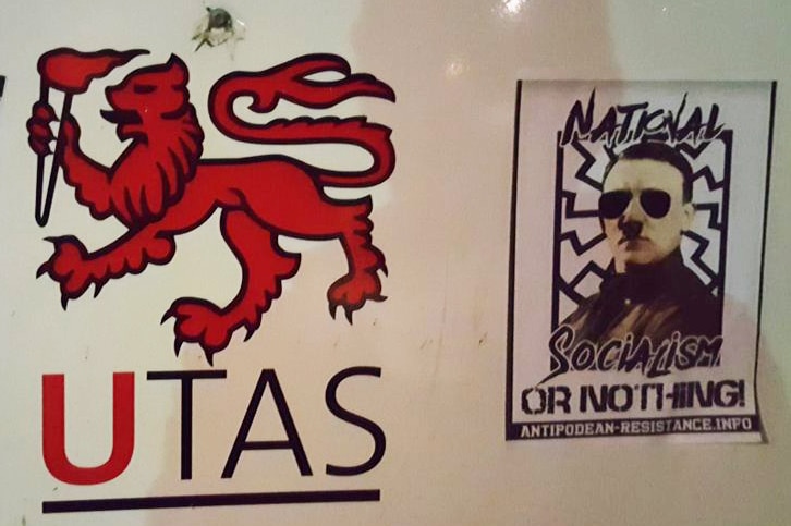 Neo-Nazi group stickers on UTAS signage.
