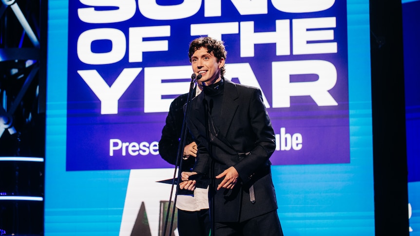Troye Sivan accepts an ARIA Award for Song of the Year.