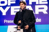 Troye Sivan accepts an ARIA Award for Song of the Year.
