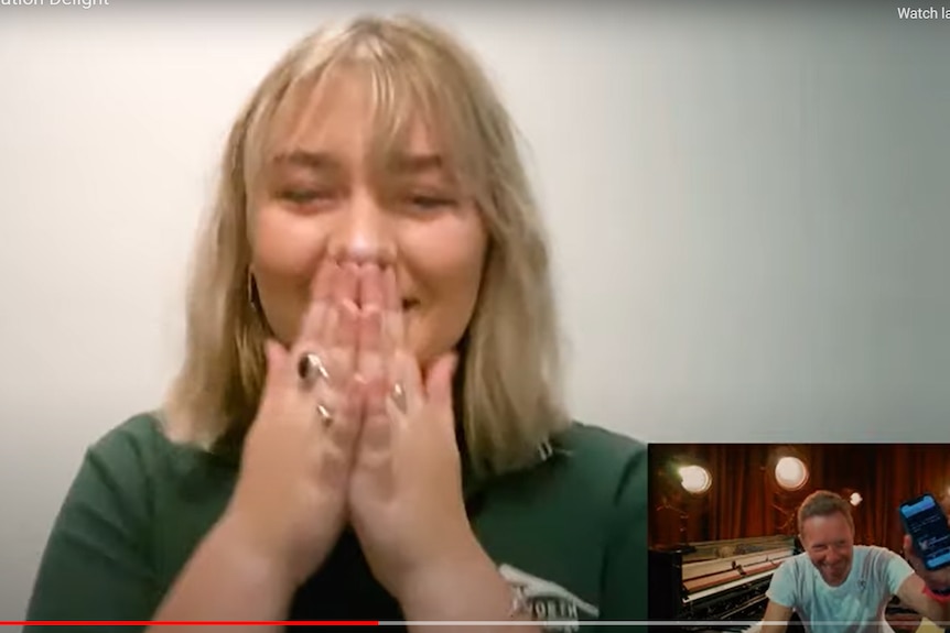 Blonde girl holds hand to her mouth, surprised