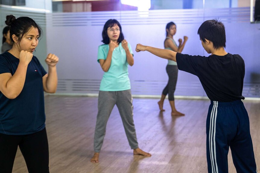 A group of women taking a class at the Myanmar Women's Self Defence League.