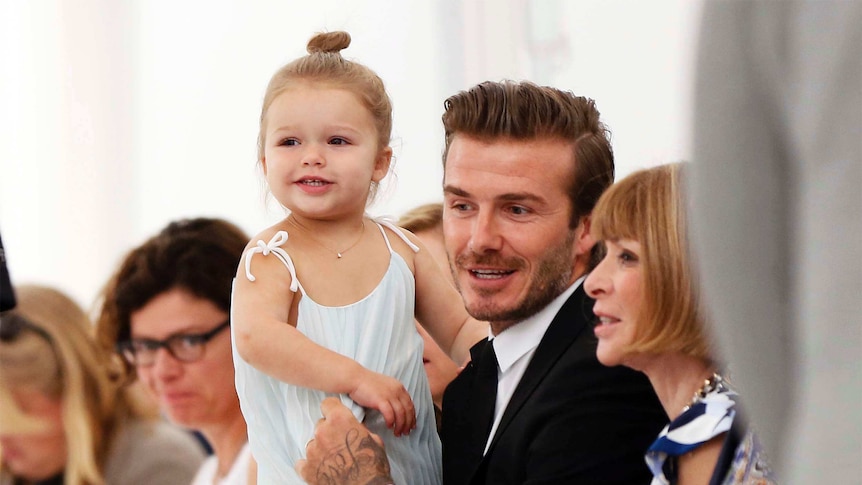 David Beckham holds his daughter Harper