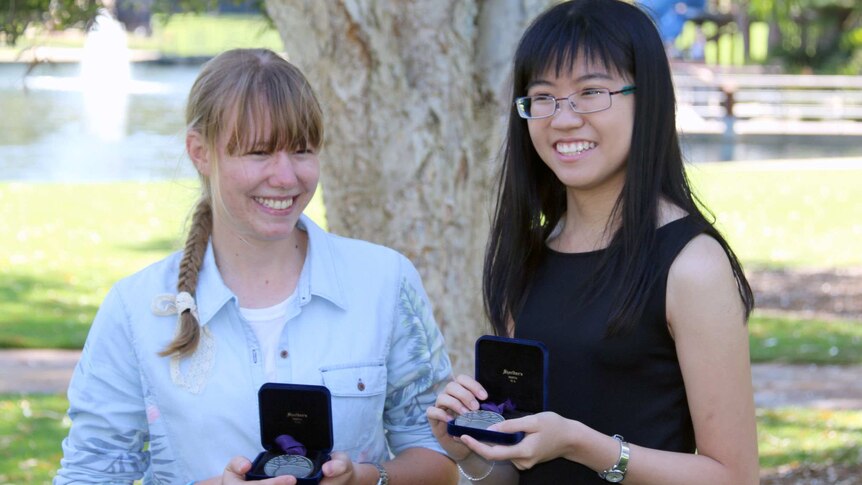 Beazley medal winners Hui Min Tay and Megan McSeveney holding their medals.
