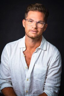 Headshot of a man in his 40s, the director Shaun Rennie