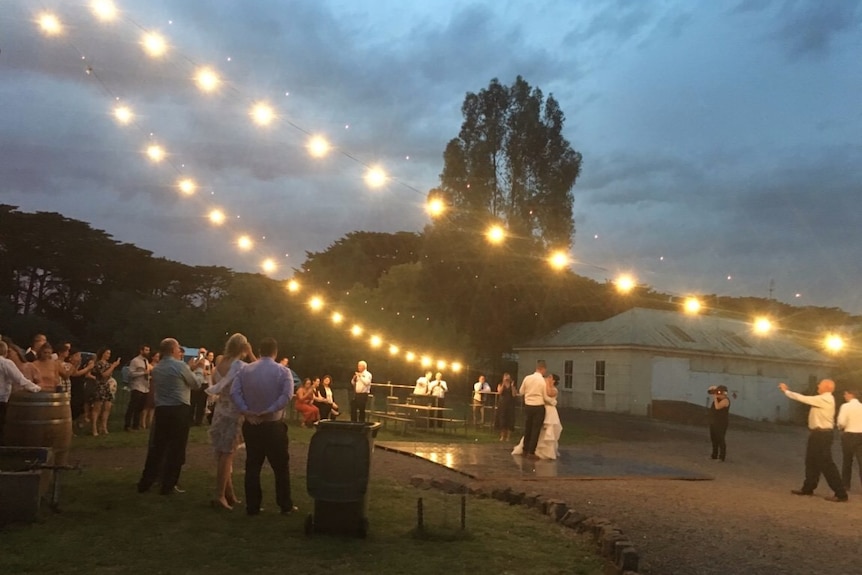 Guests watch on at the bride and groom dance at their reception at Elle Moyle's property in Gazette before the bushfire struck.